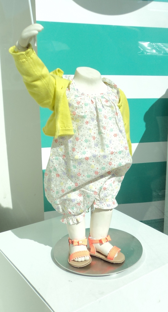 Mannequins at GAP Kids are headless yet animated - simultaneously lively and lifeless.